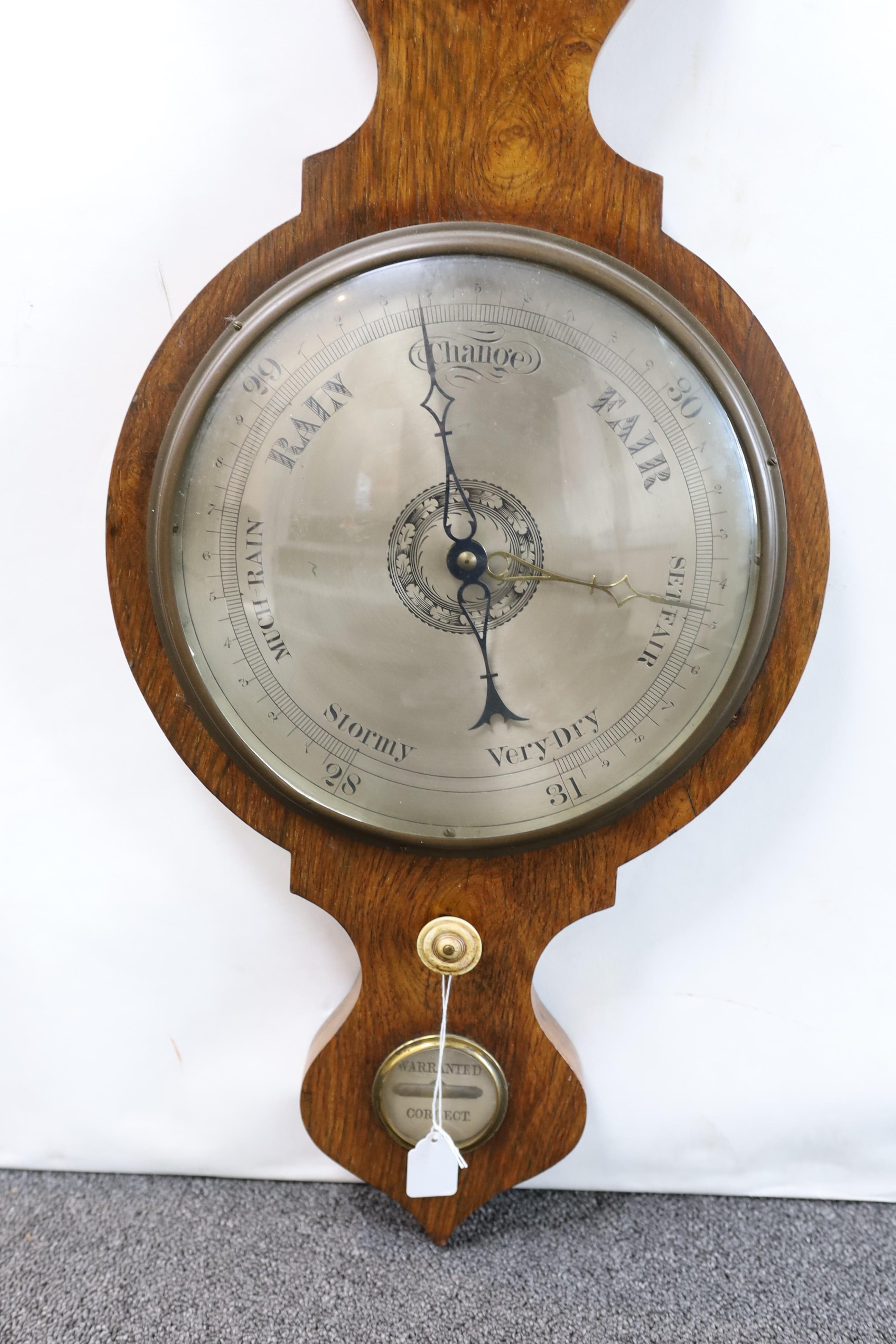 A Victorian rosewood wheel barometer and thermometer, with engraved silvered dials, height 103cm